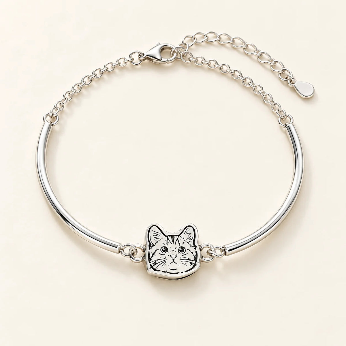 Silver half-bangle bracelet with cat portrait connecting its curved arms