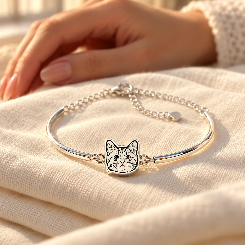 Personalized silver pet portrait bangle keepsake on ivory linen