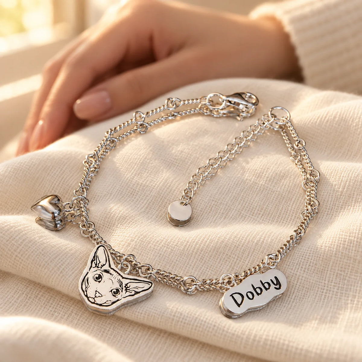 Personalized silver pet portrait name bracelet keepsake on ivory linen