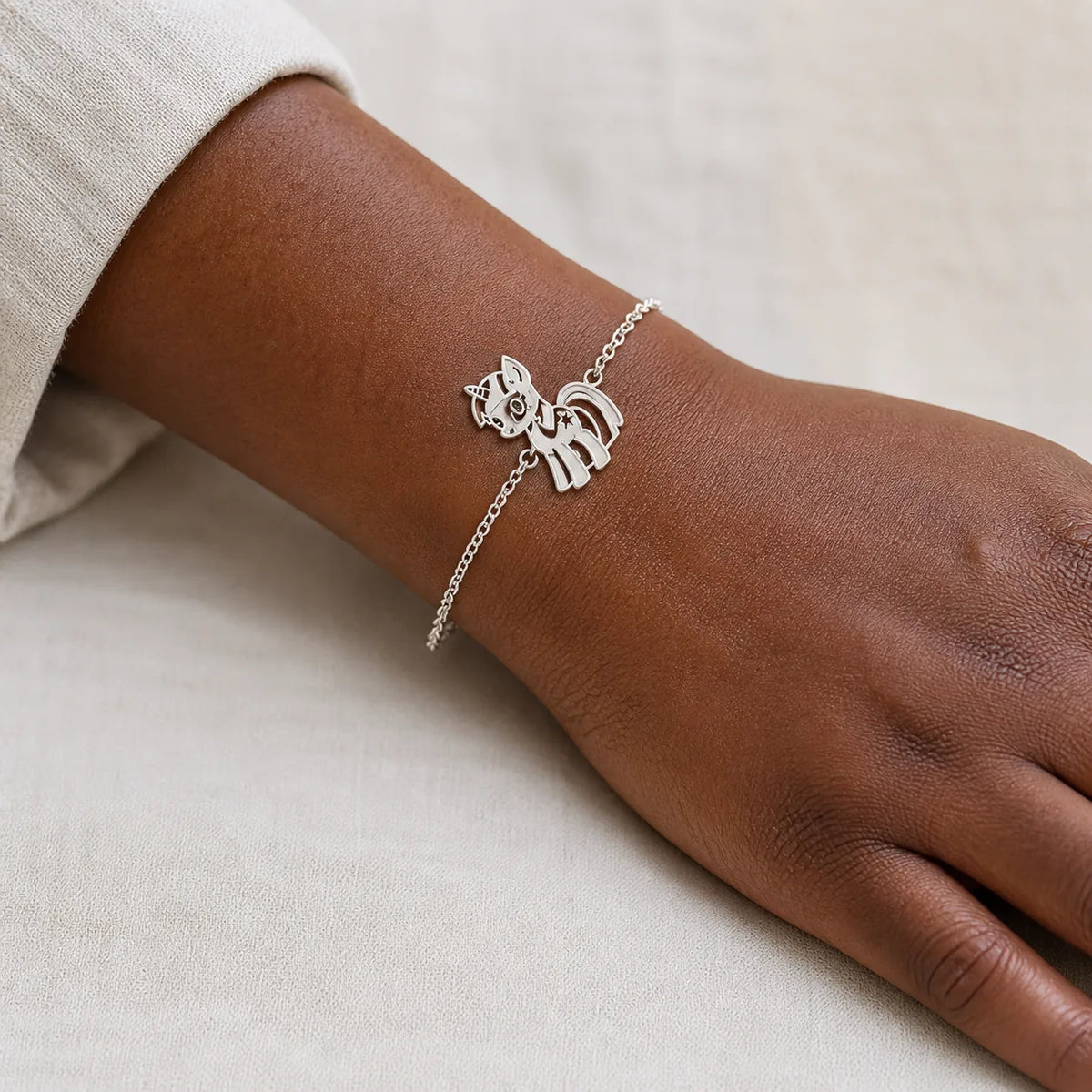 DRAWELL silver tone custom drawing chain bracelet worn on wrist