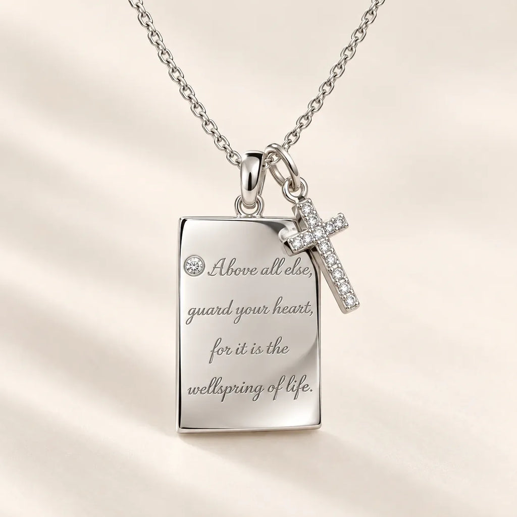 Close-up of a personalized handwriting necklace engraved in silver