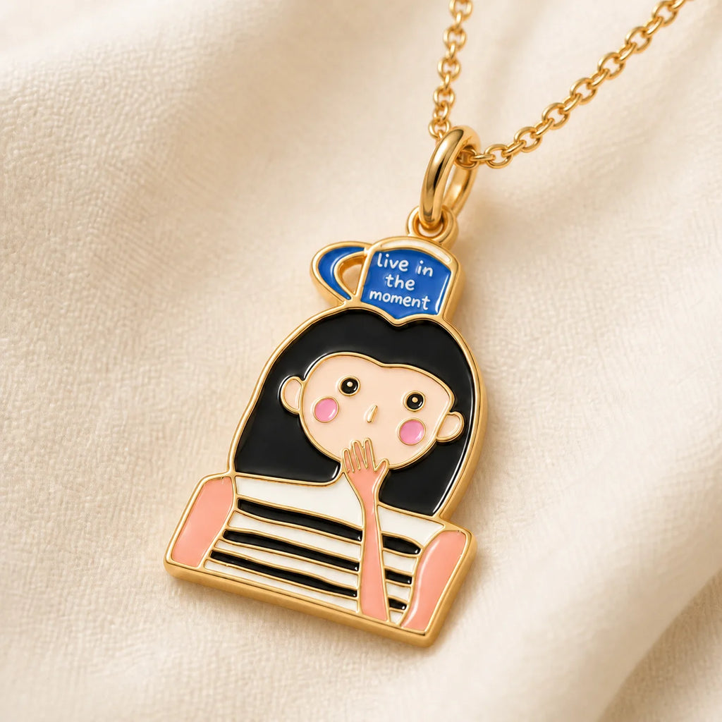 Close-up detail of a custom enamel DRAWELL necklace in gold finish