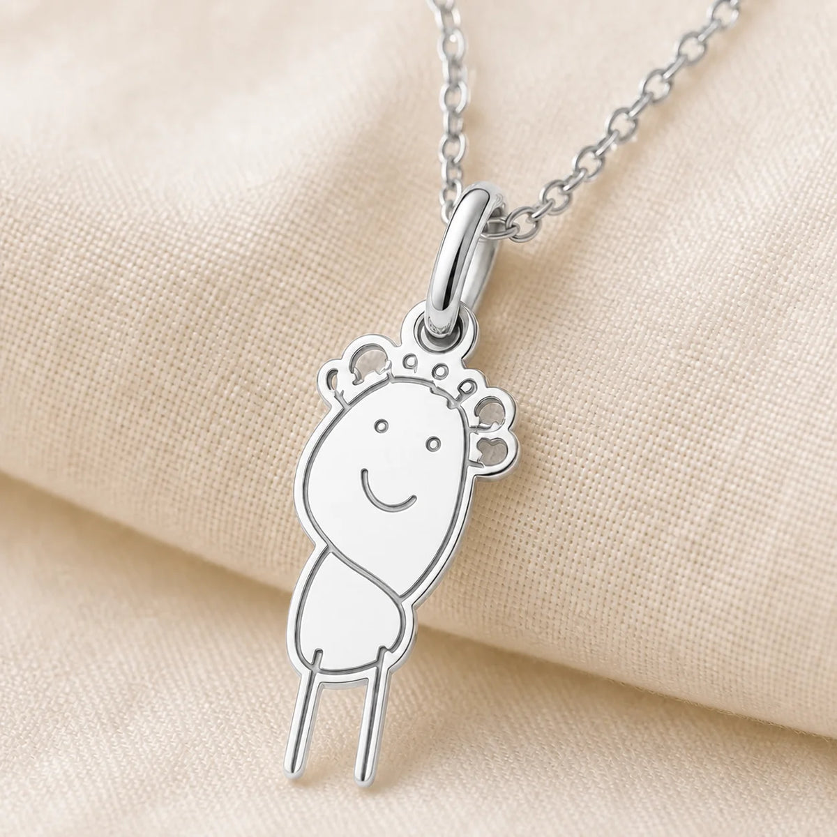Close-up detail of a custom DRAWELL necklace in silver finish