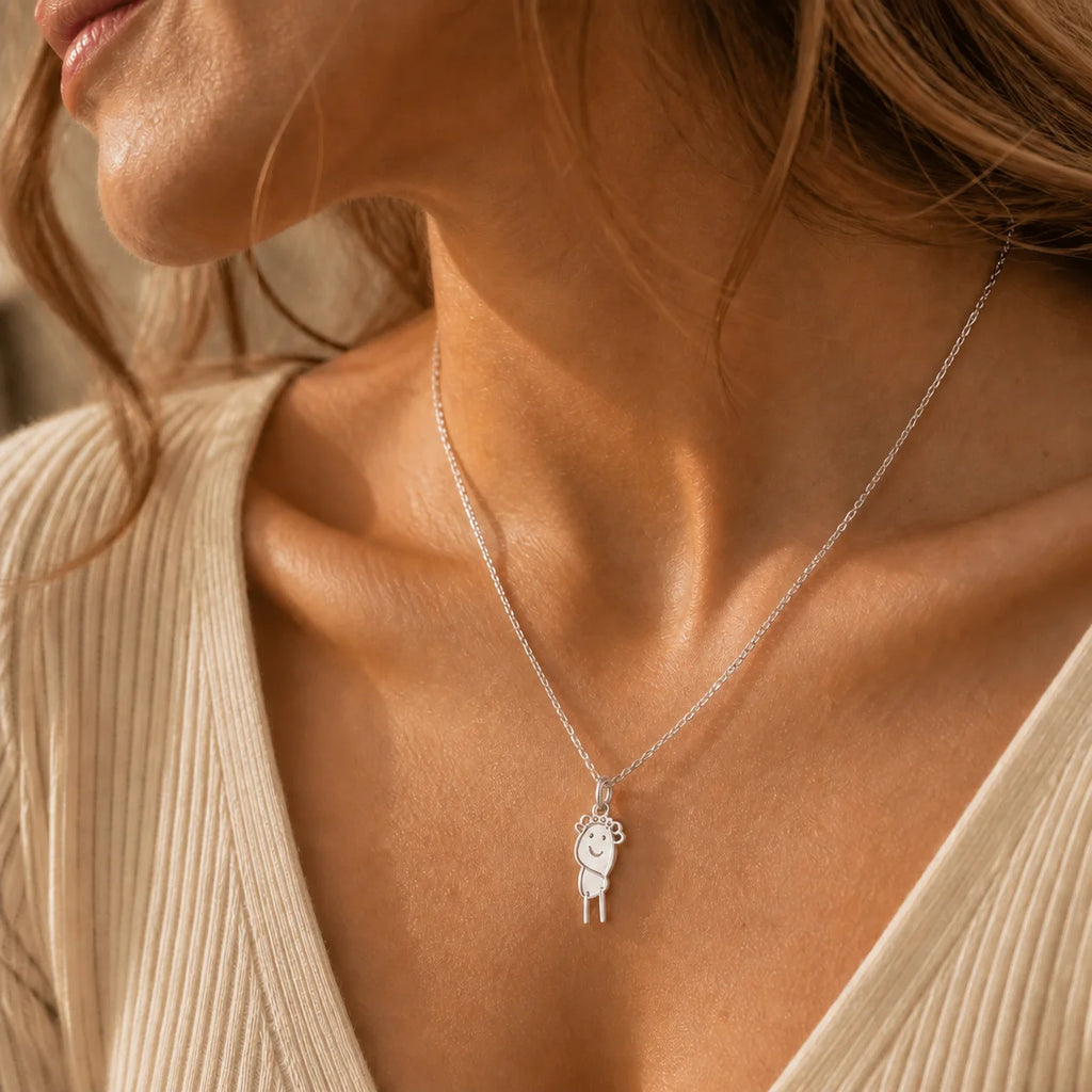 Woman wearing a custom DRAWELL necklace in silver finish
